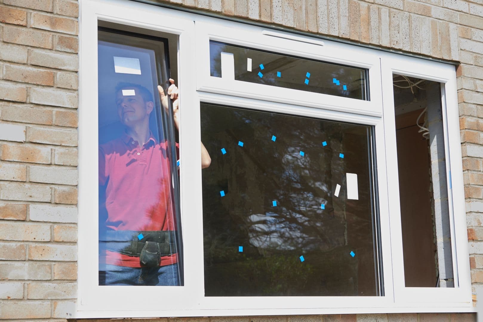 A worker installs a new window.