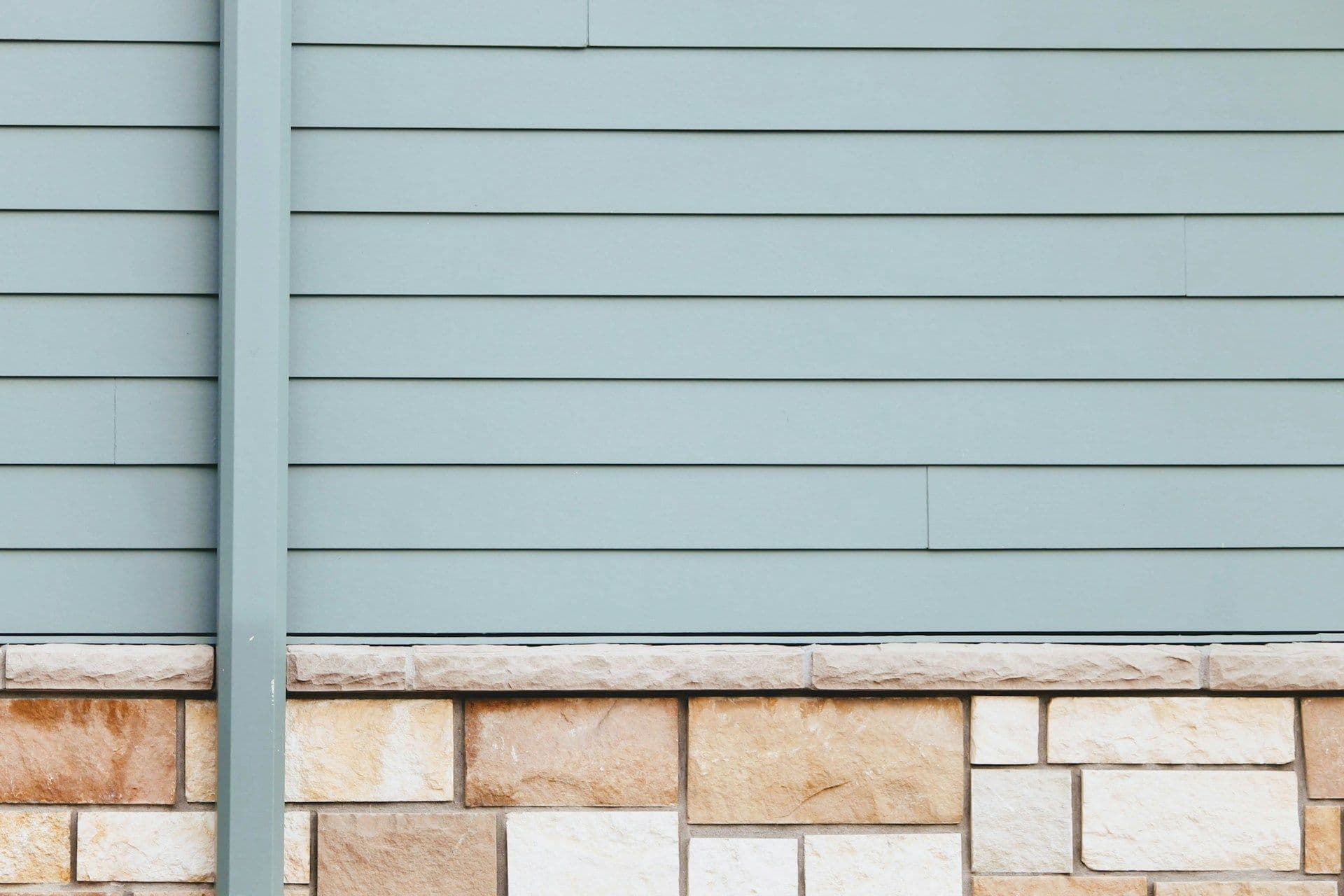 Light blue-grey vinyl siding.